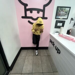 Yellow Hoodie and Black Pants Outfit